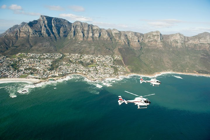 Experience breathtaking views of Cape Town's iconic coastline from Clifton Beach to the majestic Twelve Apostles all from the air on this unforgettable helicopter adventure.